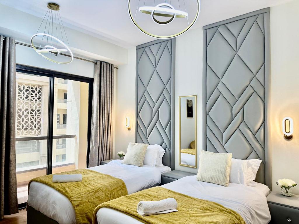 Postel nebo postele na pokoji v ubytování 2BR Luxury Apartment Marina View