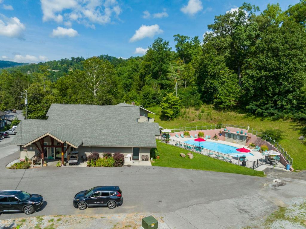 an aerial view of a house with a swimming pool at Carr's Northside Hotel and Cottages in Gatlinburg