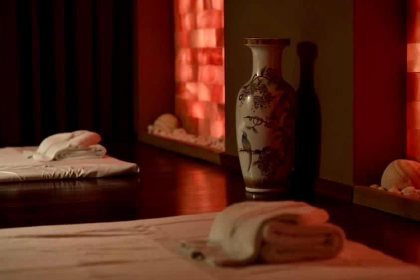 a table with a vase and a towel on it at Le Palais Art Hotel Prague in Prague