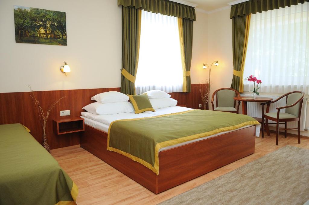 Postel nebo postele na pokoji v ubytování Apartman Bella Hotel