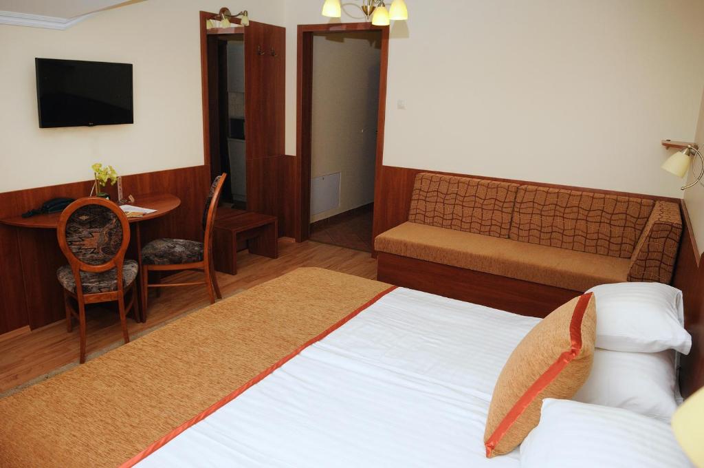 TV a/nebo společenská místnost v ubytování Apartman Bella Hotel