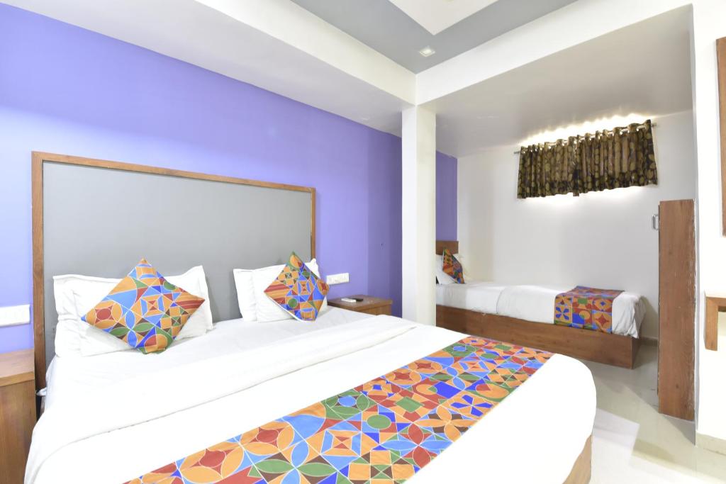 Postel nebo postele na pokoji v ubytování HOTEL GOLD LEAF