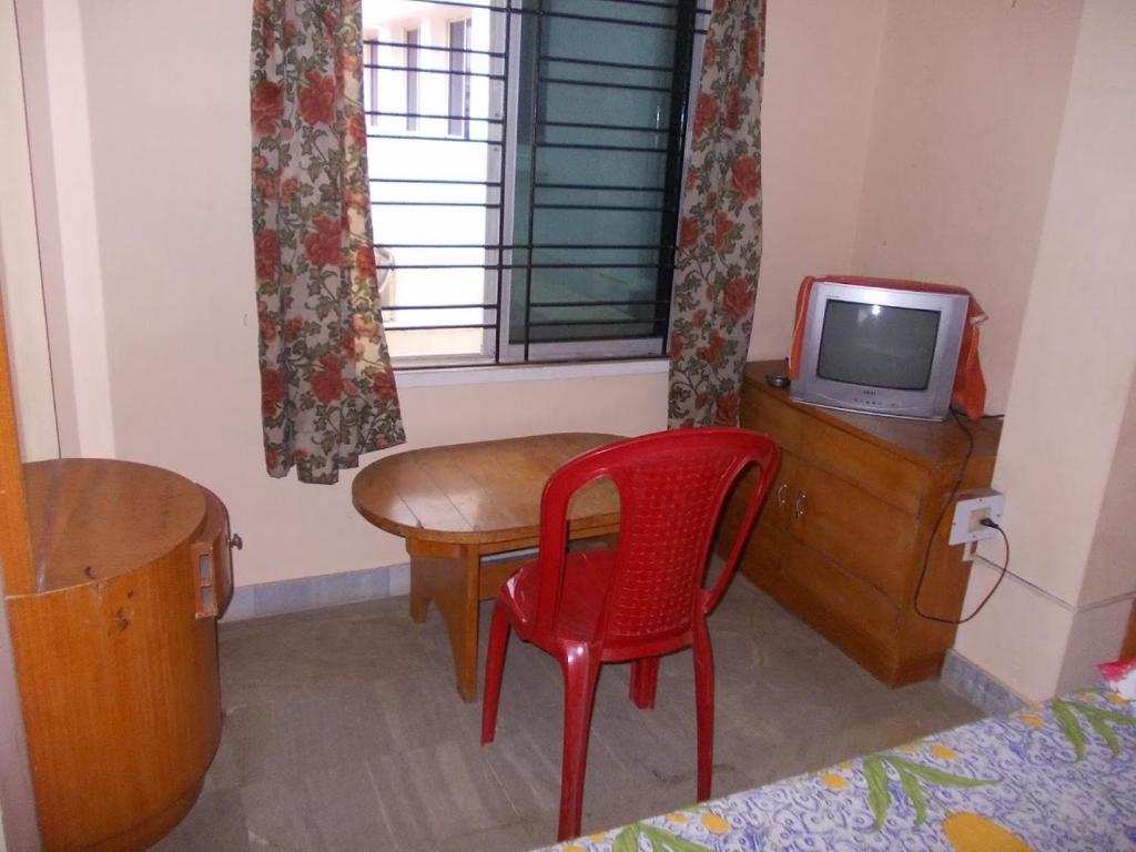 TV a/nebo společenská místnost v ubytování Rishaan Guest House