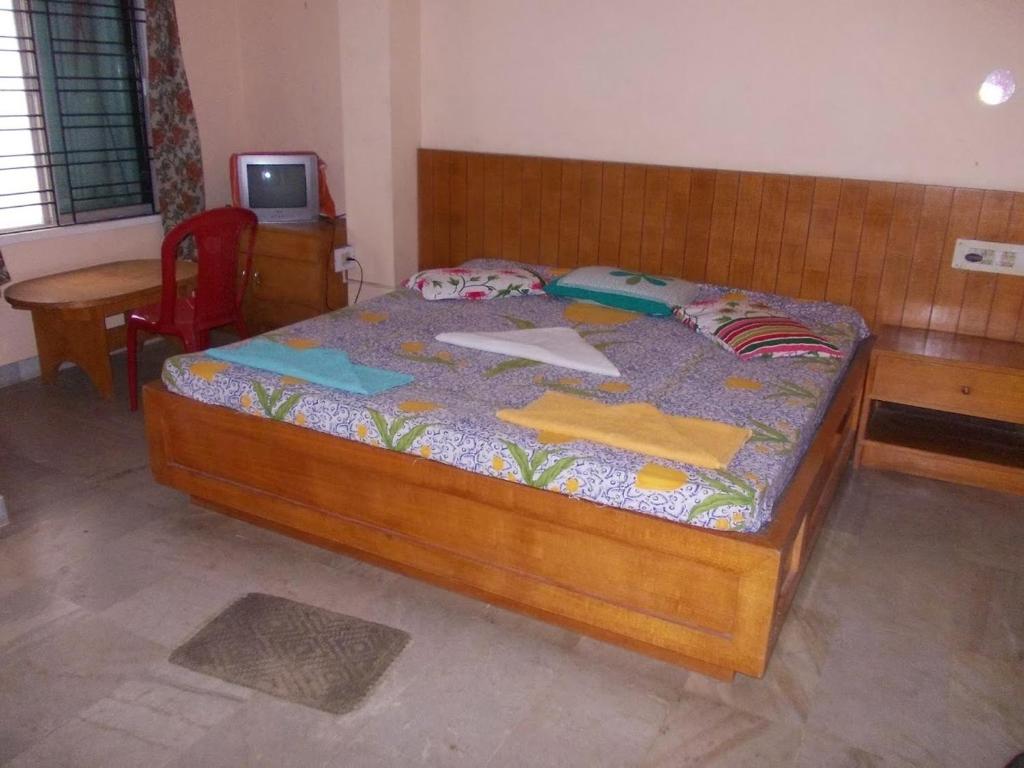 Postel nebo postele na pokoji v ubytování Rishaan Guest House