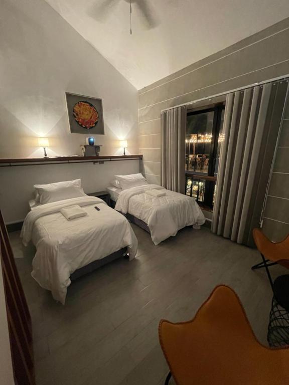 Postel nebo postele na pokoji v ubytování Urban Glamp Resort Iloilo