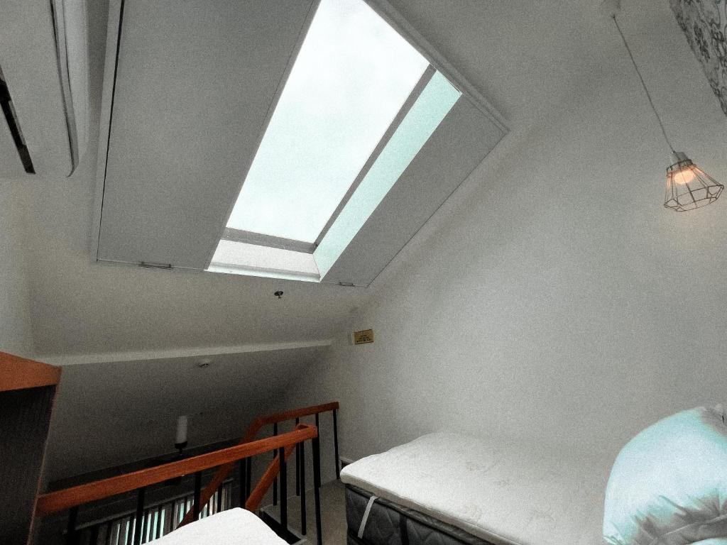 Postel nebo postele na pokoji v ubytování Urban Glamp Resort Iloilo