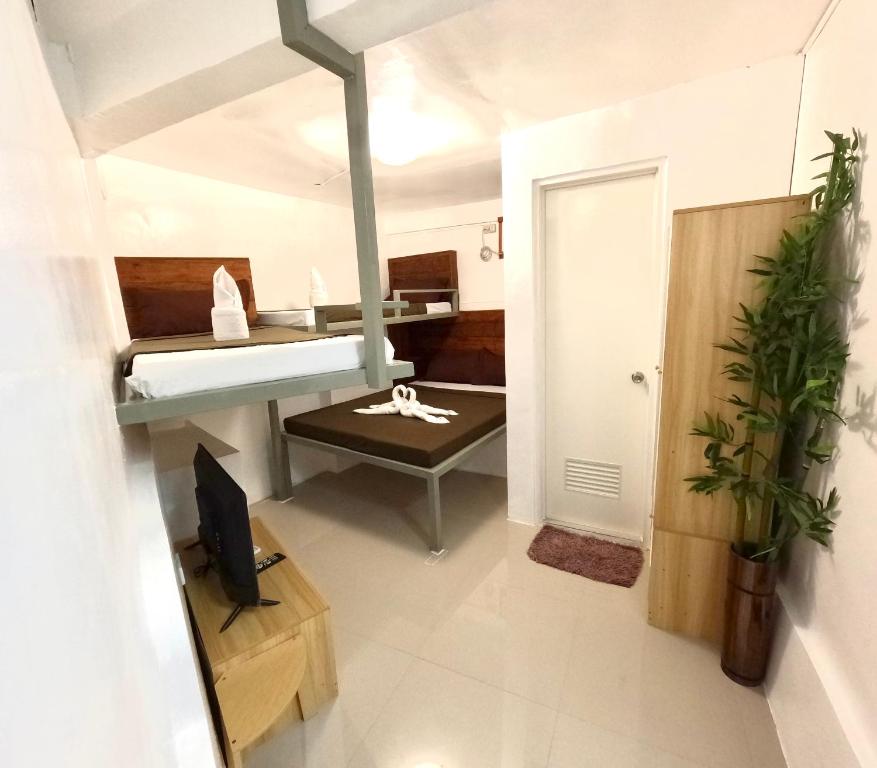 Postel nebo postele na pokoji v ubytování Prim Travellers Inn
