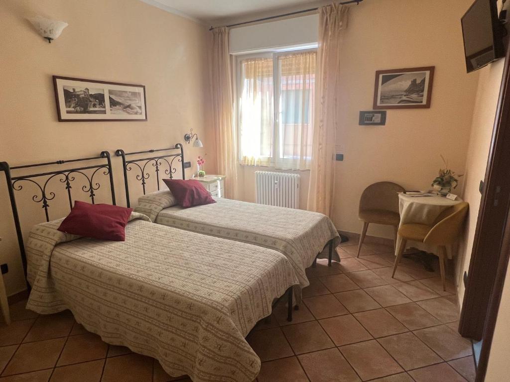 Postel nebo postele na pokoji v ubytování Il Timone Loreto