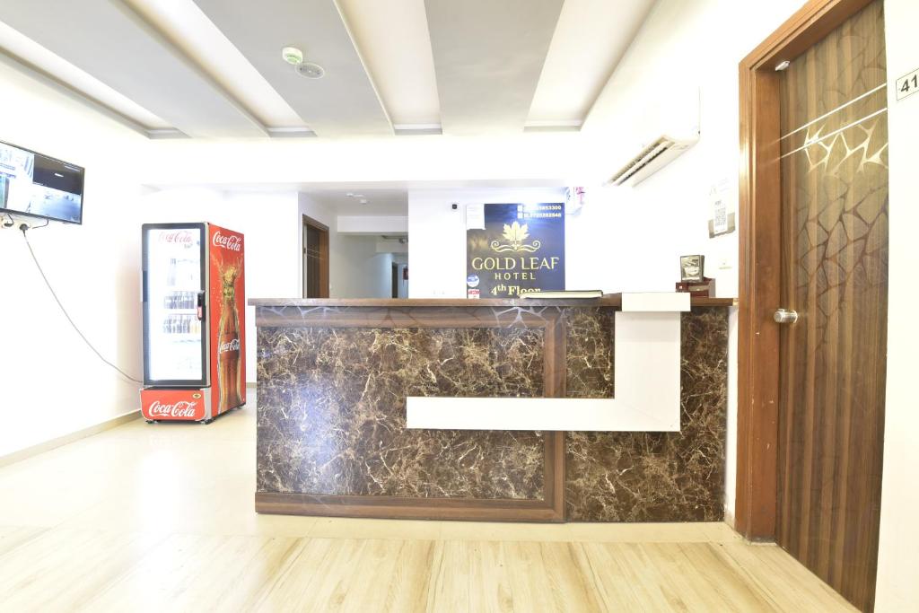 TV a/nebo společenská místnost v ubytování HOTEL GOLD LEAF