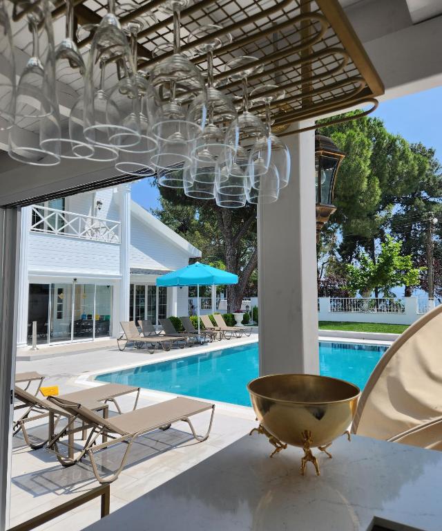 a chandelier hangs over a swimming pool at Villa No 44 in Darıca
