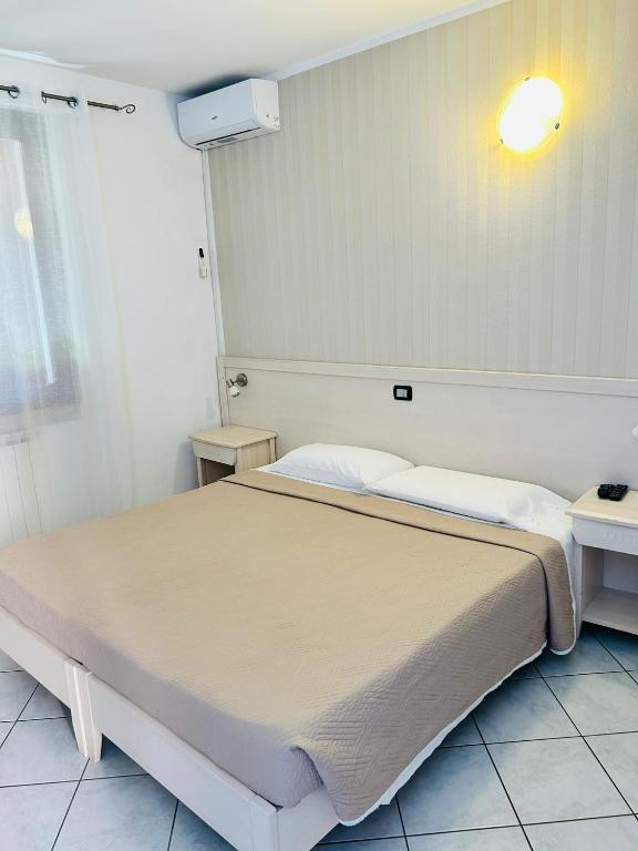 Postel nebo postele na pokoji v ubytování Villa Camporosso
