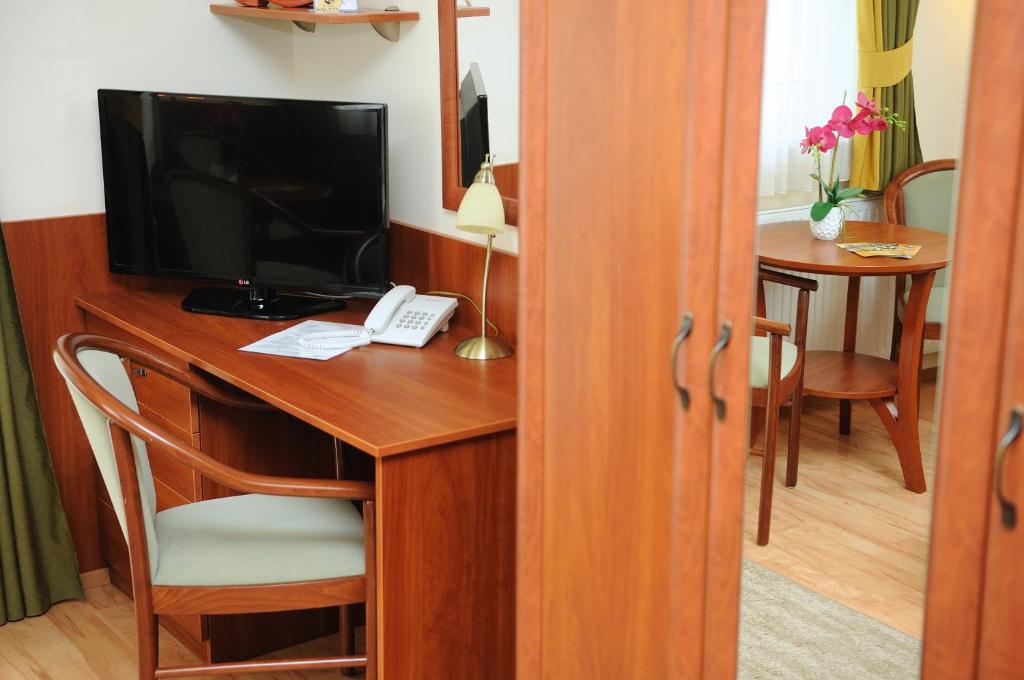 TV a/nebo společenská místnost v ubytování Apartman Bella Hotel