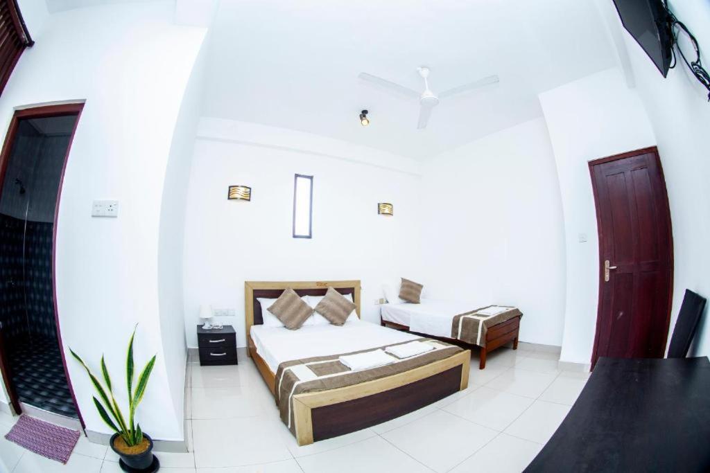 Postel nebo postele na pokoji v ubytování Hotel Blue Bird