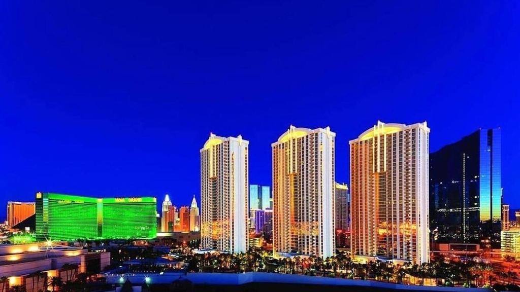 a city skyline at night with tall buildings at MGM Signature Towers by FantasticStay in Las Vegas