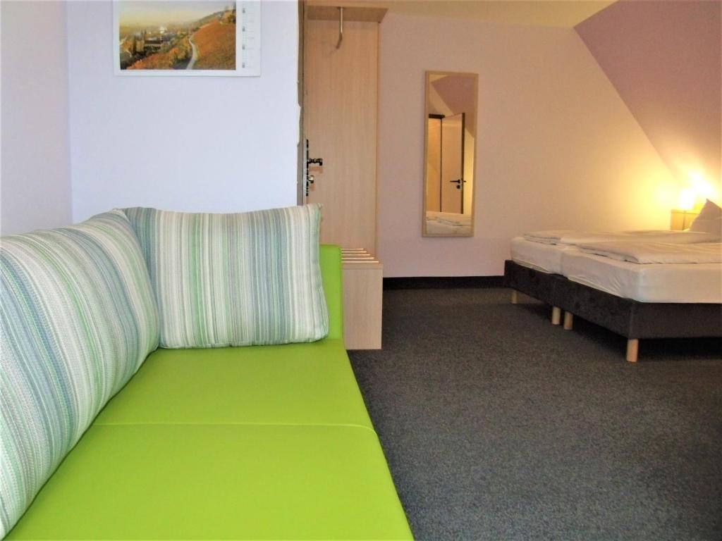 Postel nebo postele na pokoji v ubytování Hotel Brehm