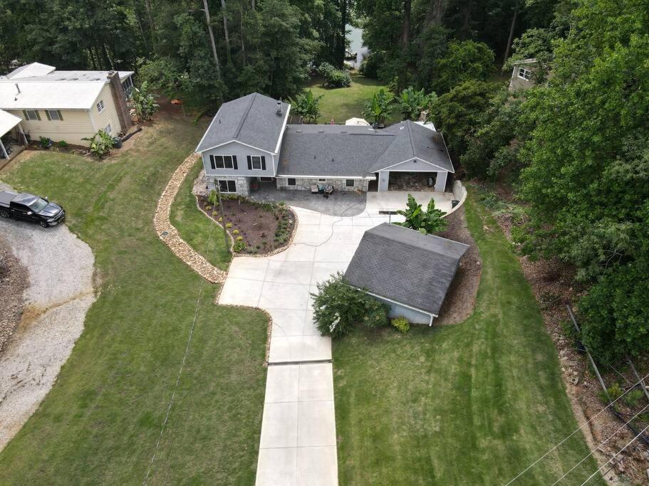an aerial view of a house with a driveway at Cozy 4br Lake Lanier GA Waterfront- Great Location in Gainesville