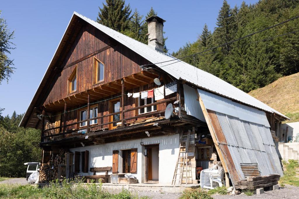 a large wooden house with at Chalet D'alpage Authentique in Queige