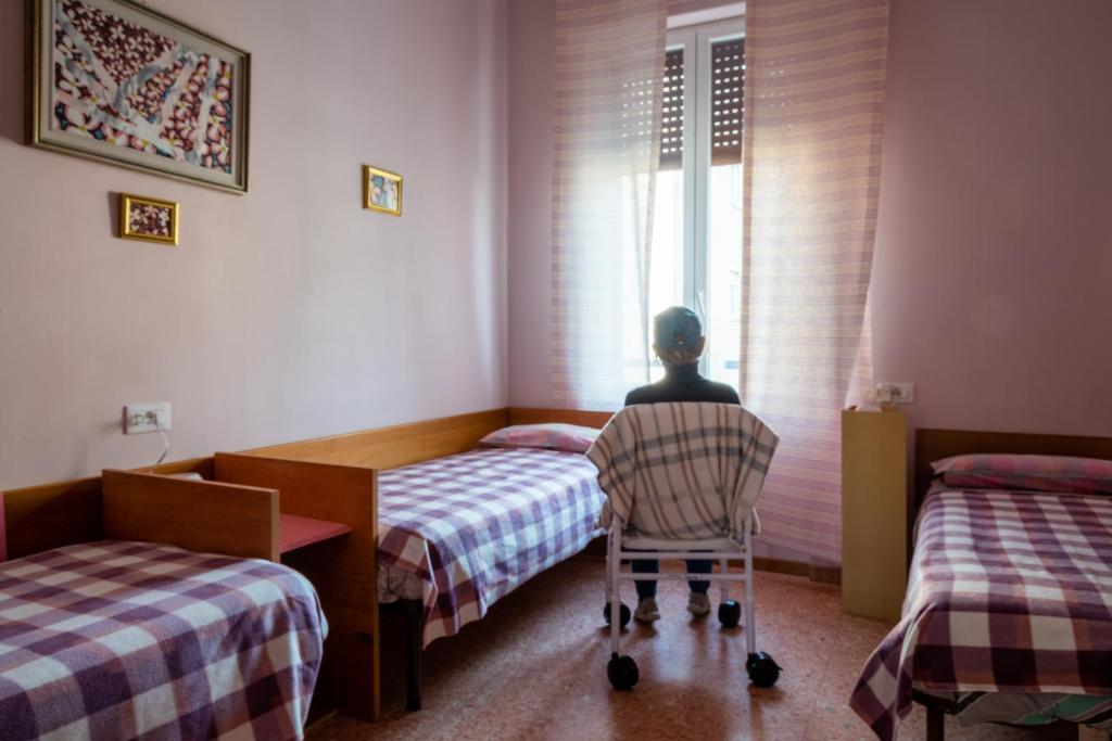 Postel nebo postele na pokoji v ubytování Dacia di Bergamo