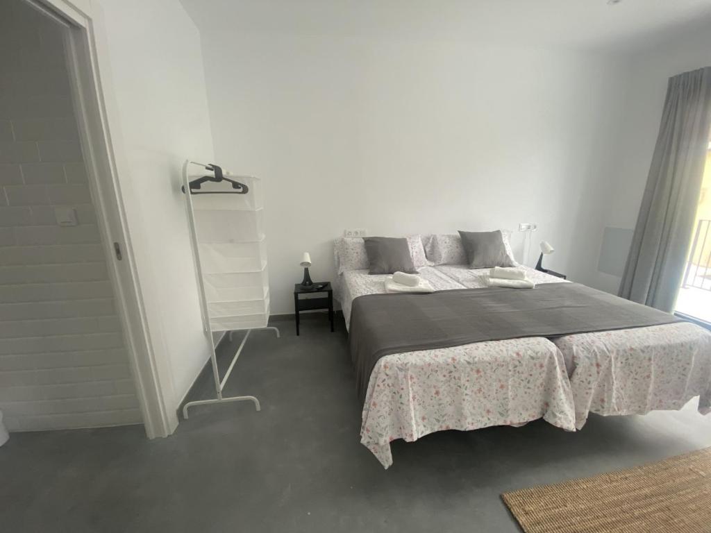 Postel nebo postele na pokoji v ubytování Santamira Street