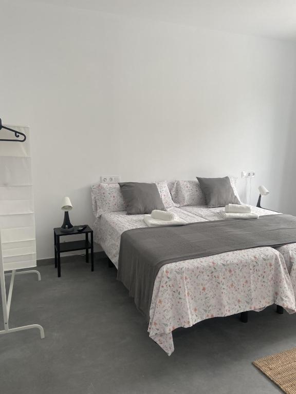 Postel nebo postele na pokoji v ubytování Santamira Street