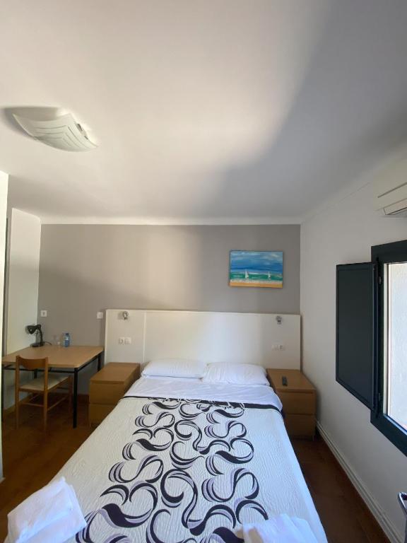 Postel nebo postele na pokoji v ubytování Hotel Les Roques