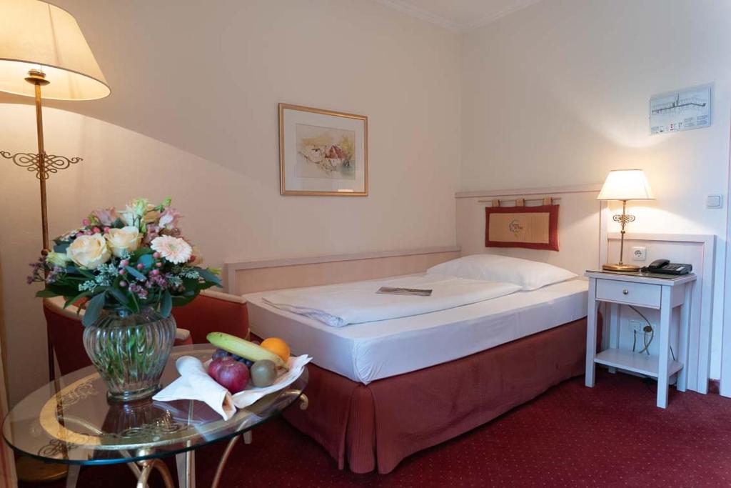 Postel nebo postele na pokoji v ubytování Hotel im Park