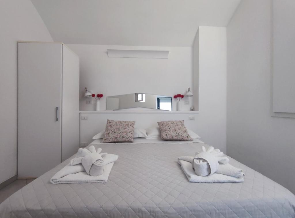 Posteľ alebo postele v izbe v ubytovaní Casa dei Gemelli
