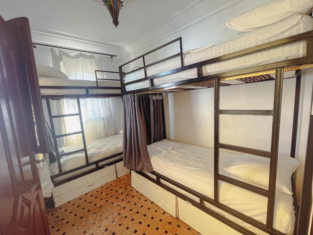 Voodi või voodid majutusasutuse Tangier Kasbah Hostel toas