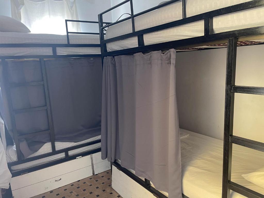 Voodi või voodid majutusasutuse Tangier Kasbah Hostel toas