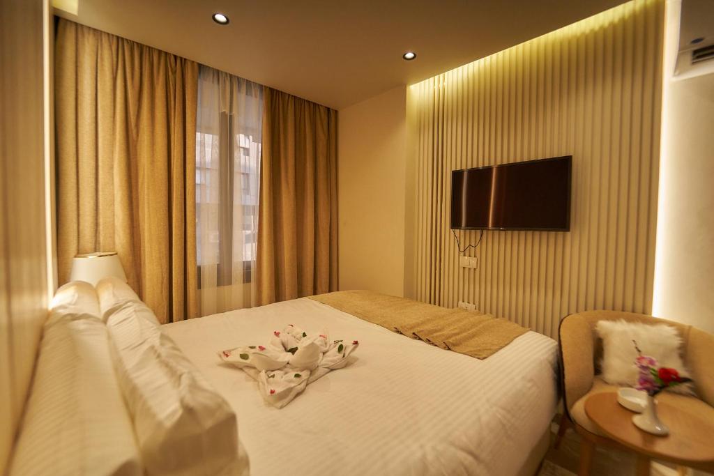 TV a/nebo společenská místnost v ubytování Gold's Pyramids Hotel