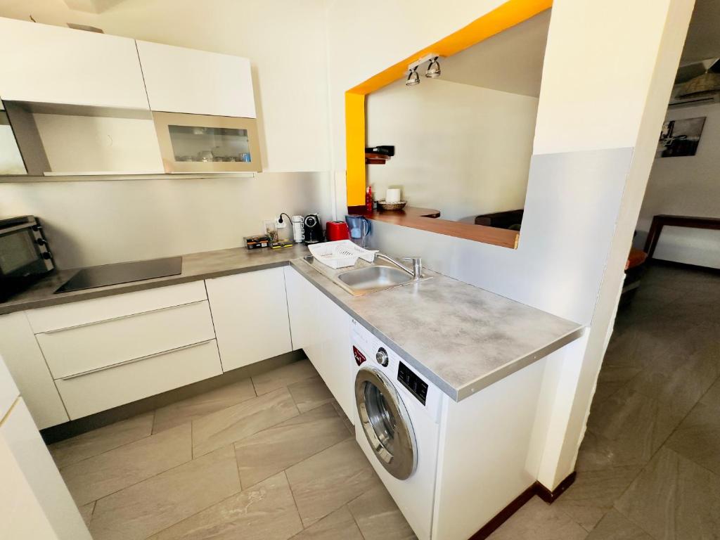 Kuchyň nebo kuchyňský kout v ubytování Maison sur la plage