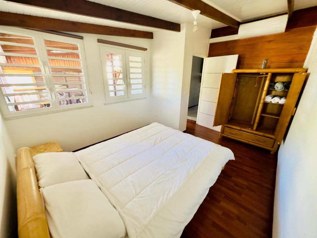 Postel nebo postele na pokoji v ubytování Maison sur la plage