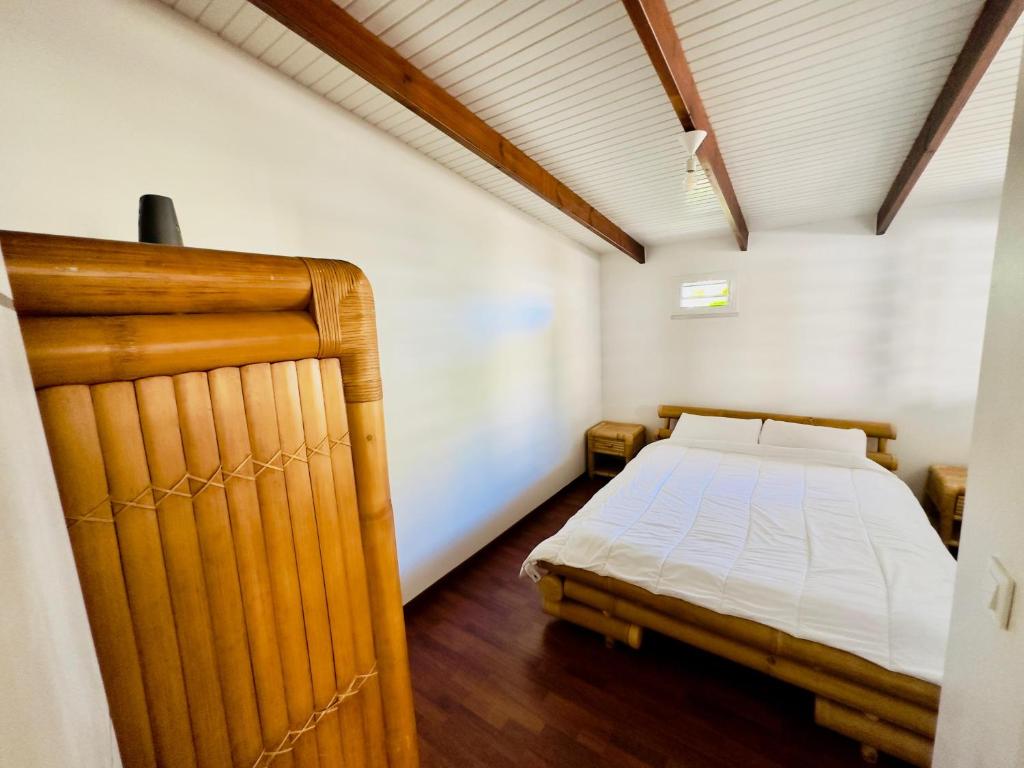 Postel nebo postele na pokoji v ubytování Maison sur la plage