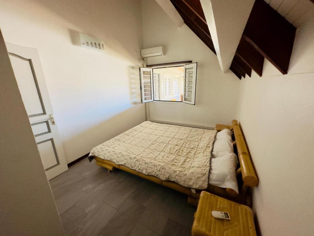 Postel nebo postele na pokoji v ubytování Maison sur la plage
