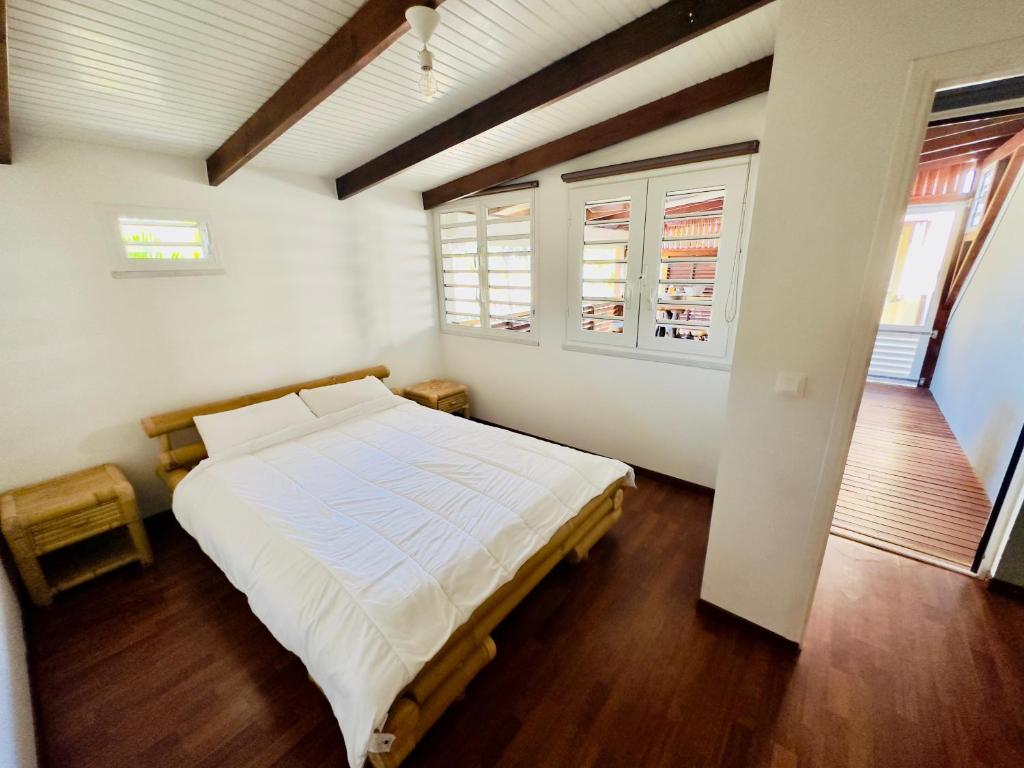 Postel nebo postele na pokoji v ubytování Maison sur la plage
