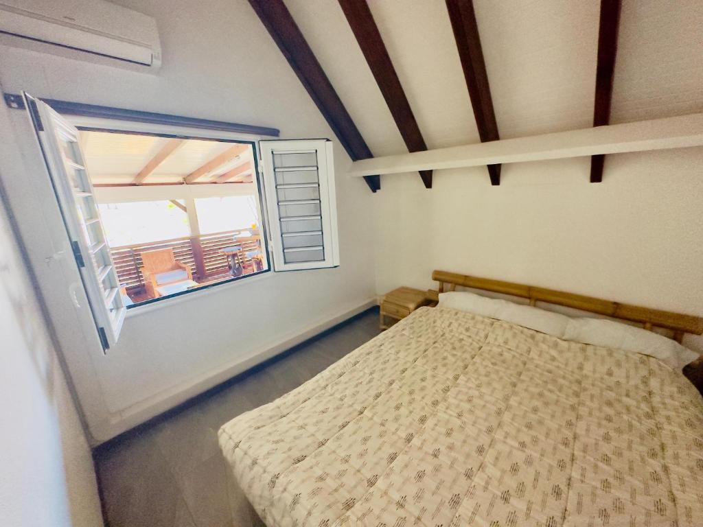 Postel nebo postele na pokoji v ubytování Maison sur la plage