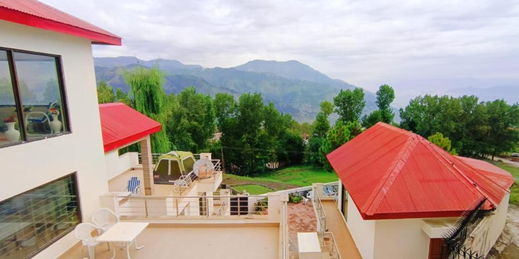 a view of a house with a red roof at Haven Resort Bhurban, Murree in Bhurban