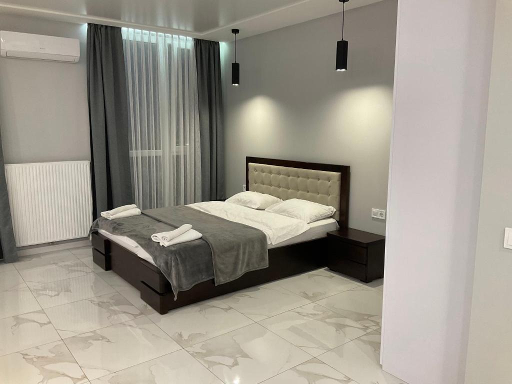 Ένα ή περισσότερα κρεβάτια σε δωμάτιο στο VIP Apartment Avalon