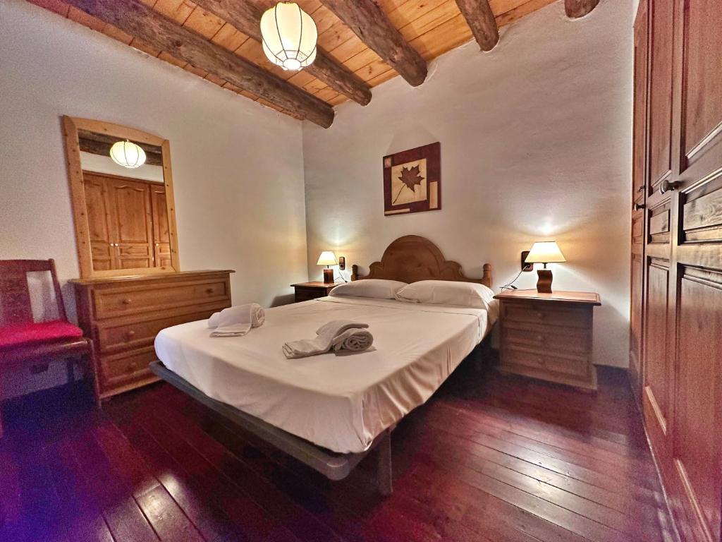 Postel nebo postele na pokoji v ubytování D2, Bordes d'Arinsal, Duplex Rustico con chimenea, Arinsal , zona Vallnord