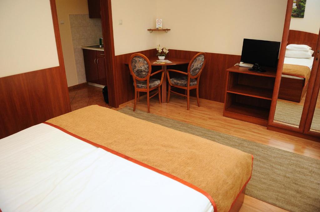 Postel nebo postele na pokoji v ubytování Apartman Bella Hotel