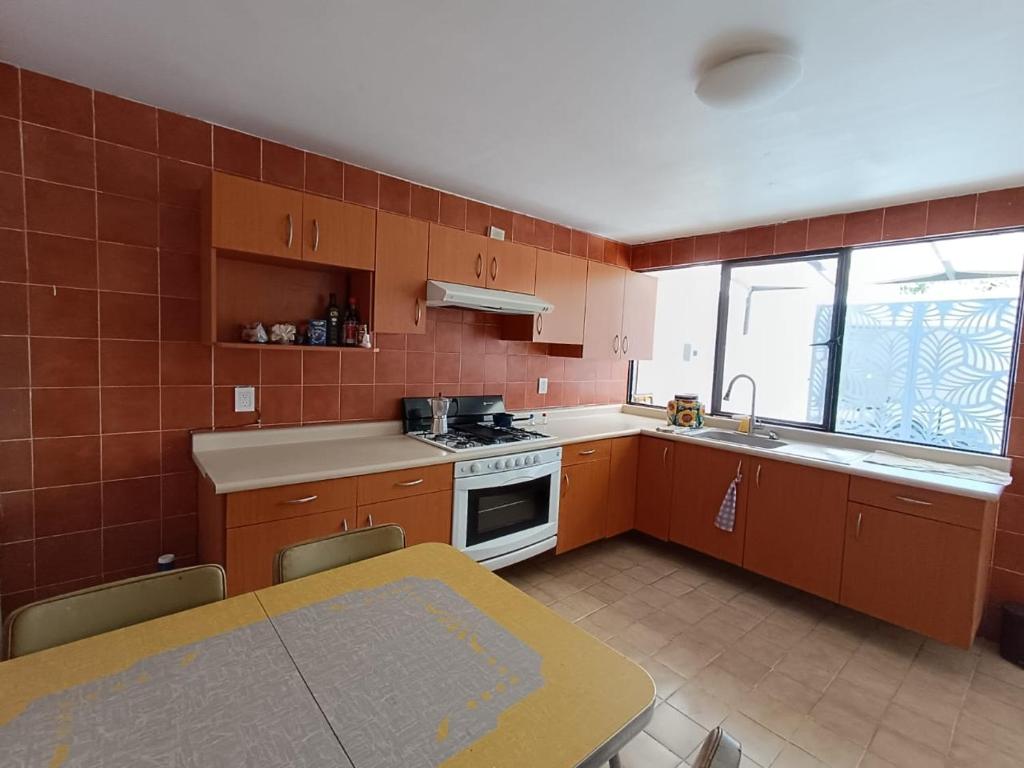 Kuchyň nebo kuchyňský kout v ubytování Casa Arena