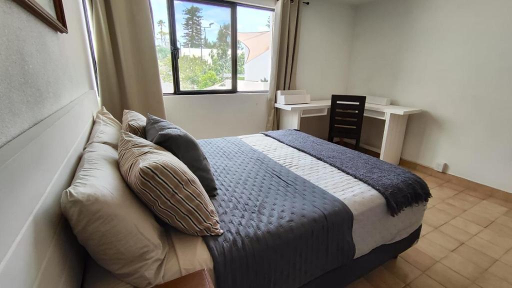 Postel nebo postele na pokoji v ubytování Casa Arena
