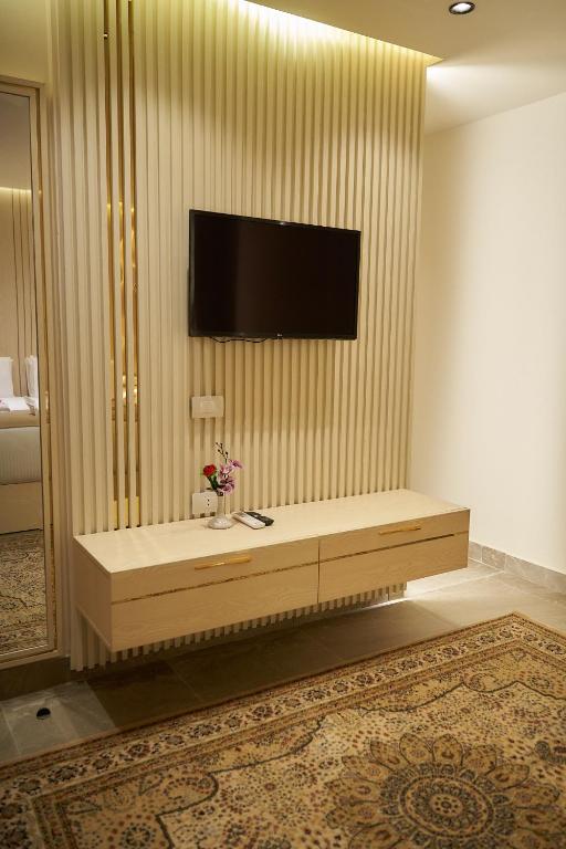 TV a/nebo společenská místnost v ubytování Gold's Pyramids Hotel
