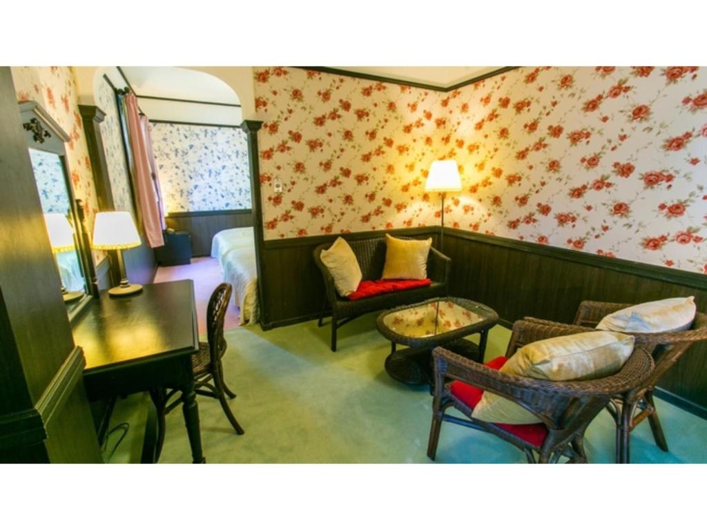 a hotel room with a bed and a table and chairs at Restaurant & Hotel Traumerei - Vacation STAY 47810v in Hakuba