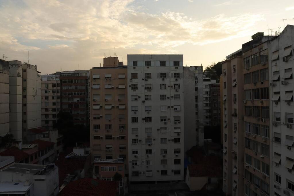 a view of a city with tall buildings at estúdio reformado em copacabana in Rio de Janeiro