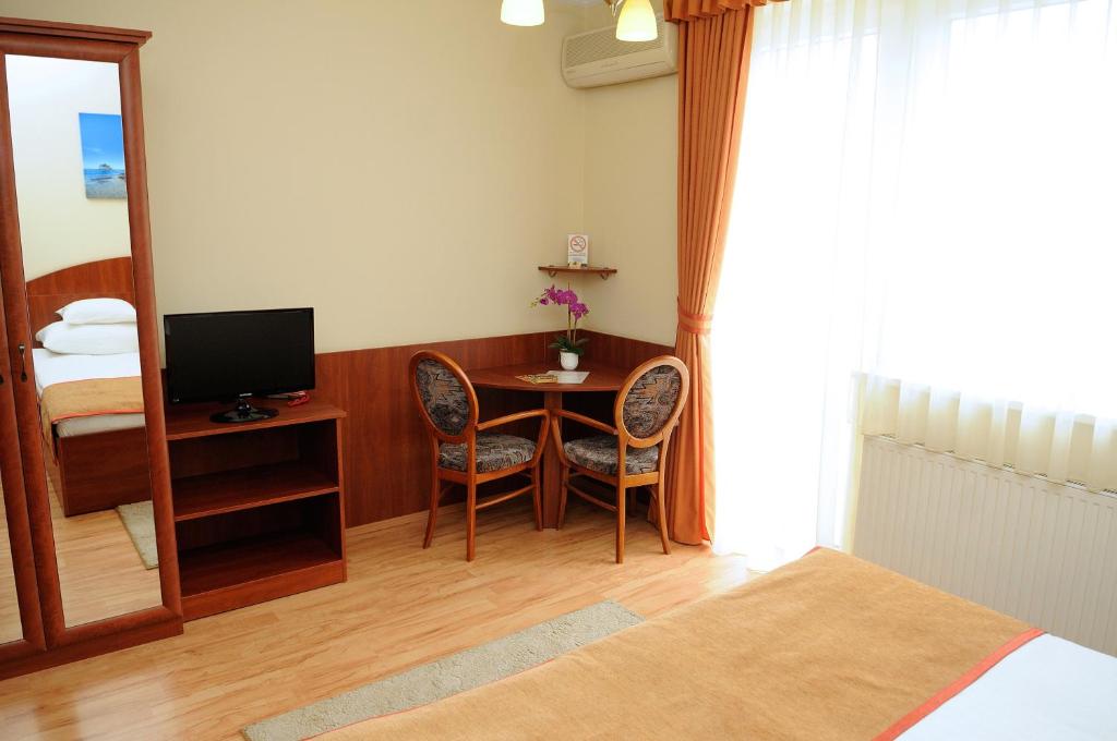 TV a/nebo společenská místnost v ubytování Apartman Bella Hotel