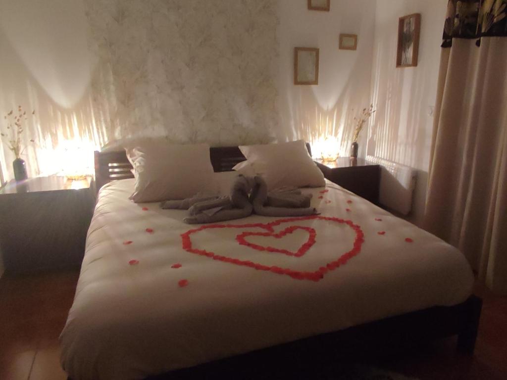a bed with a heart painted on it at Chambre d&#39;hôte Amouratcha in Fabrègues