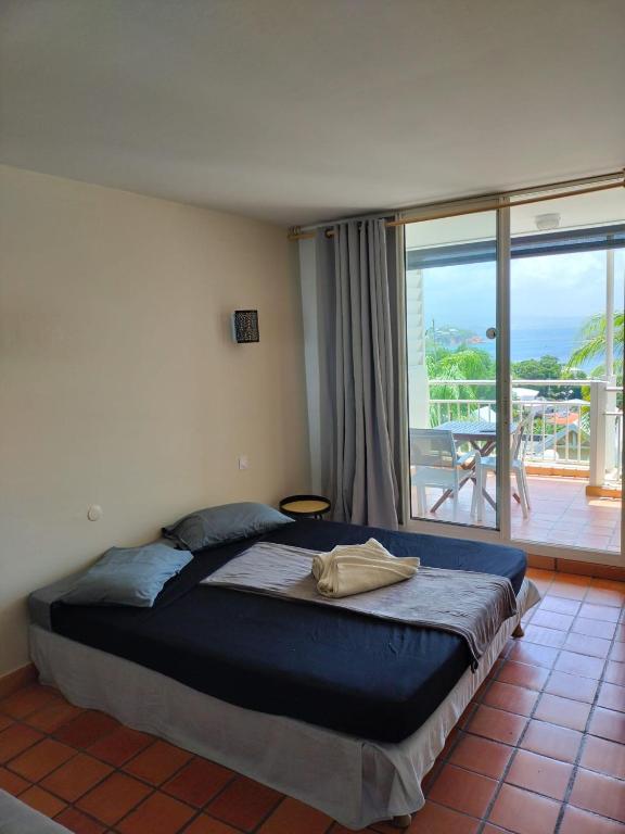 Postel nebo postele na pokoji v ubytování Appartements vue mer - Résidence de la baie - Tartane