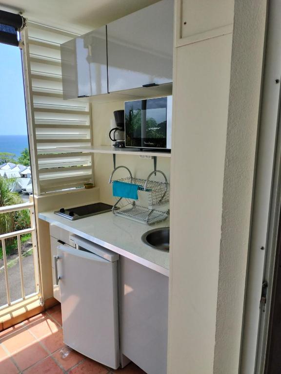 Kuchyň nebo kuchyňský kout v ubytování Appartements vue mer - Résidence de la baie - Tartane