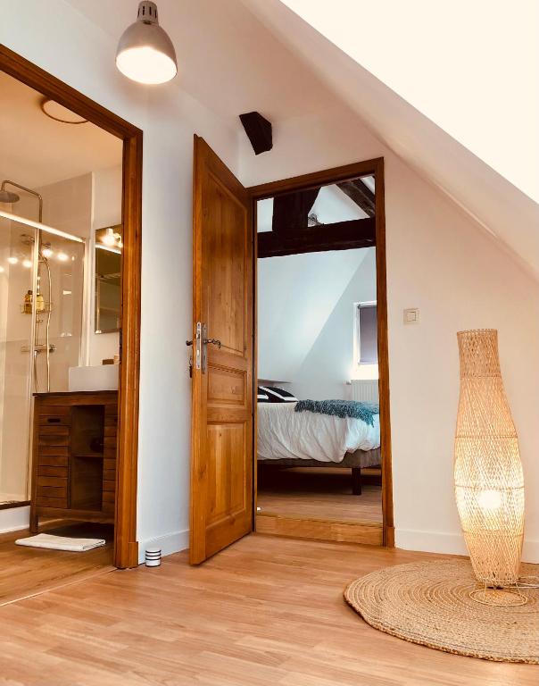 Postel nebo postele na pokoji v ubytování L’AMANTINE Chambres d’hôtes et gîte
